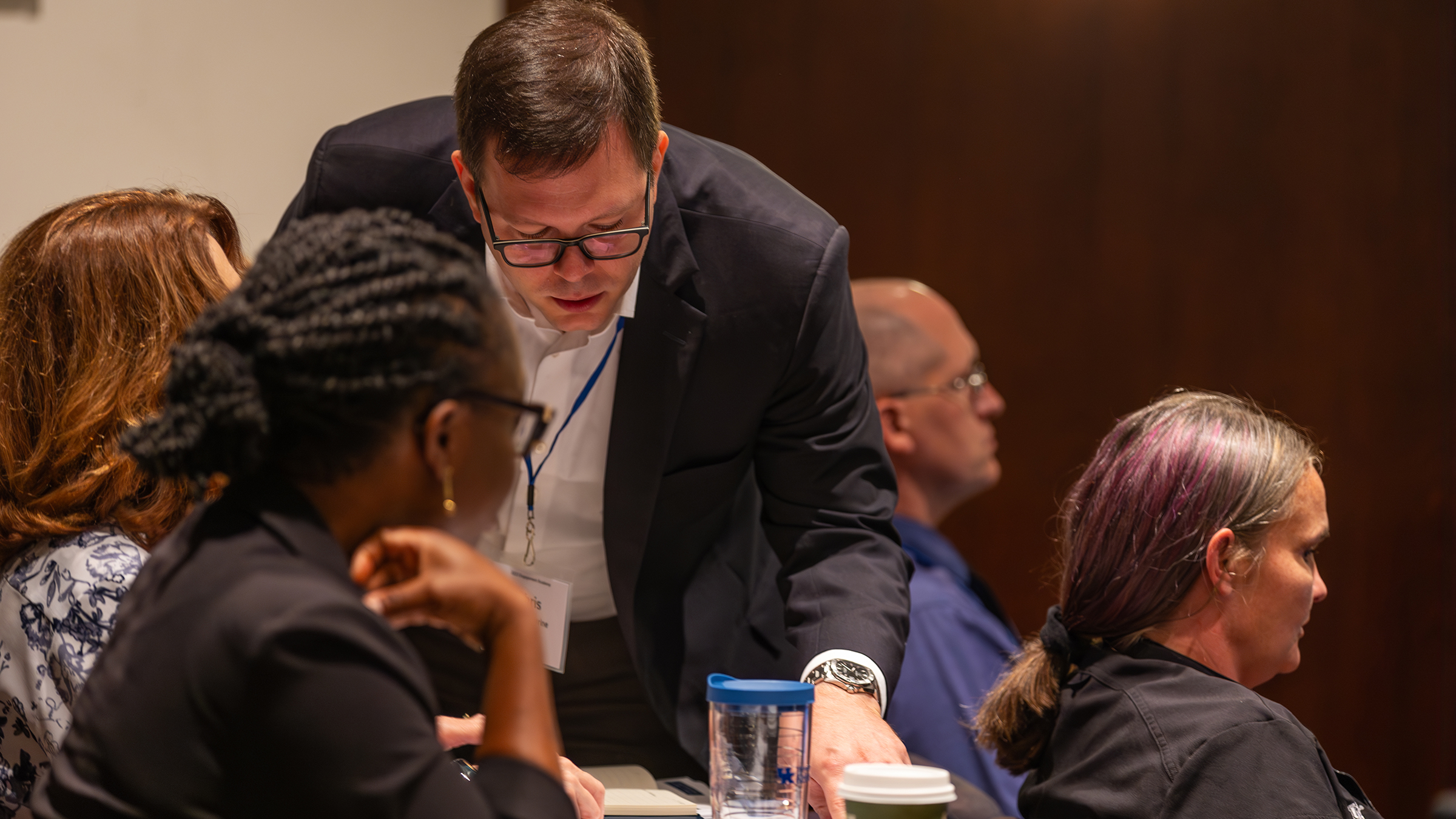 A person points to a paper at the 2023 event