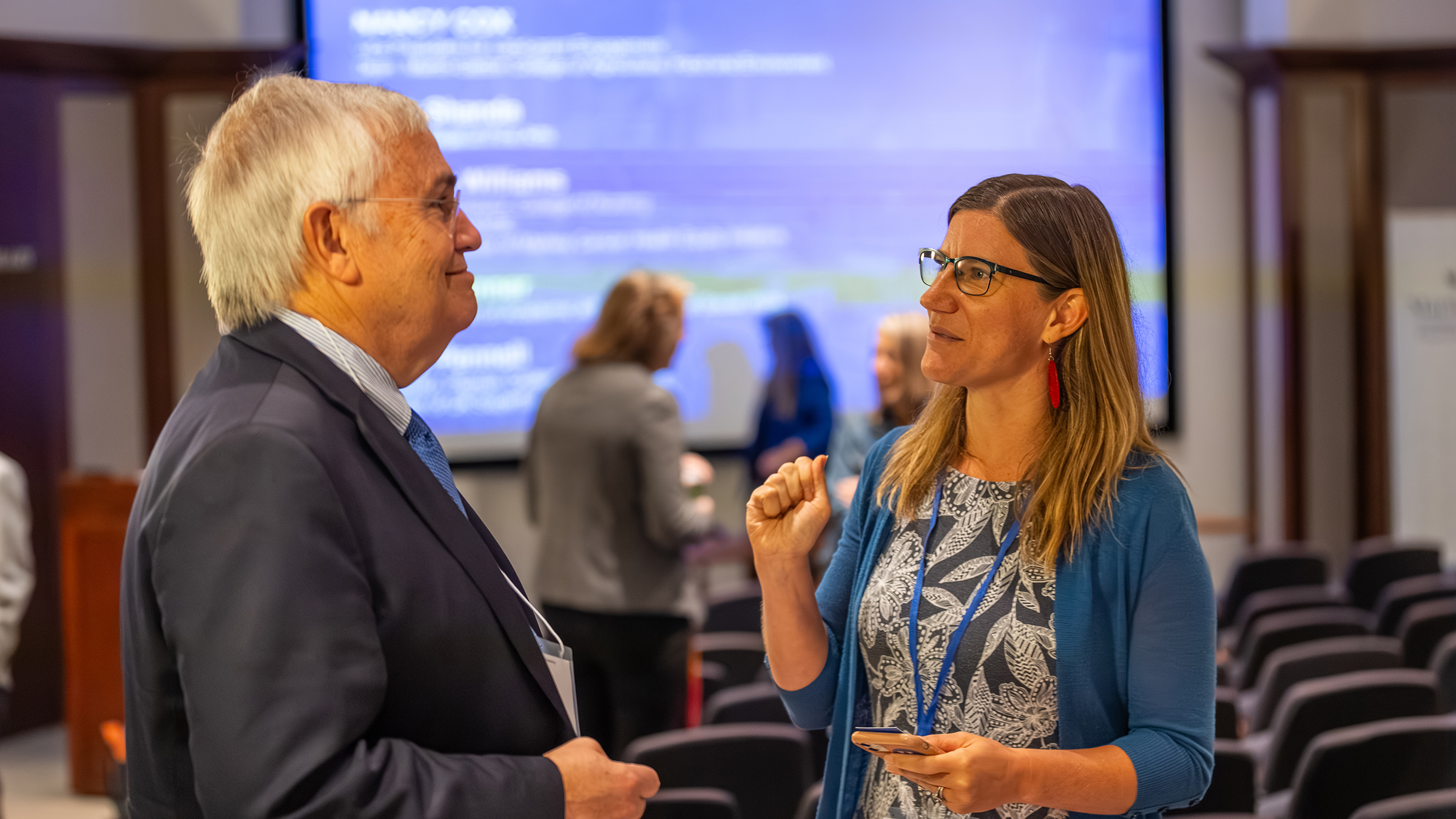 Two people talk at the 2023 event