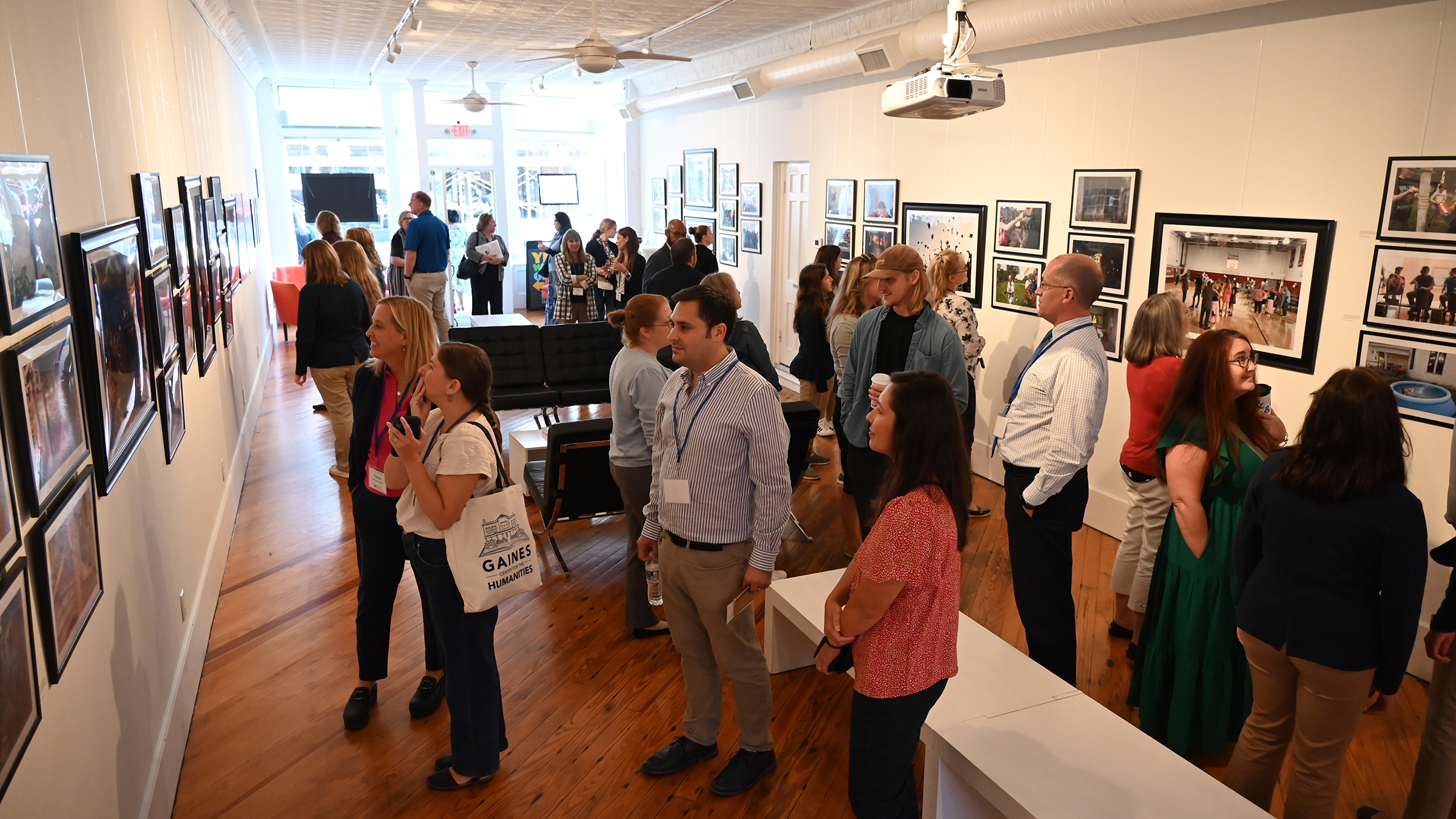 People look at art at a gallery
