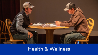 Health & wellness text with two men sitting at a table