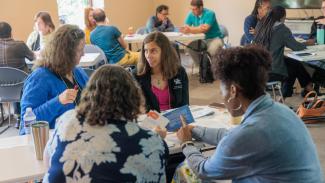 Group participants discussing ideas at a workshop.