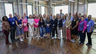 Participants in the UK Land-grant Engagement Bus Tour gather at the Paducah School of Art and Design.